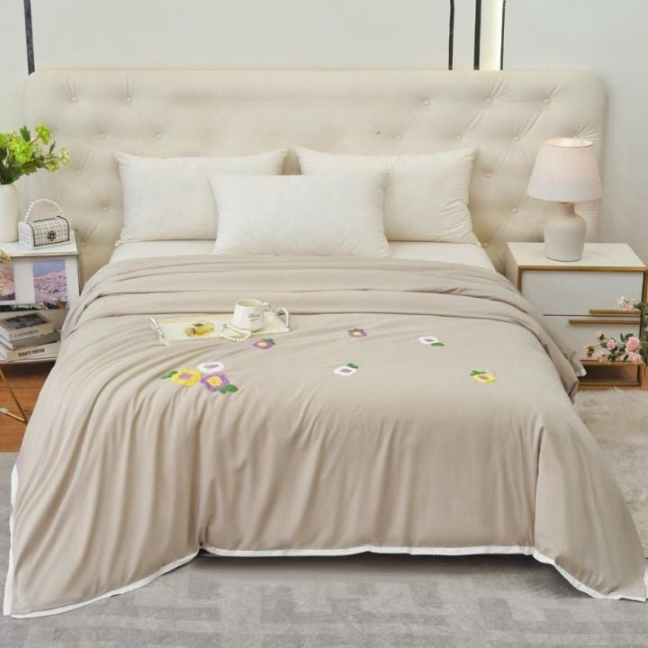 The Gharnish Florista double bed embroidery comforter with floral patterns and intricate stitching on soft fabric.