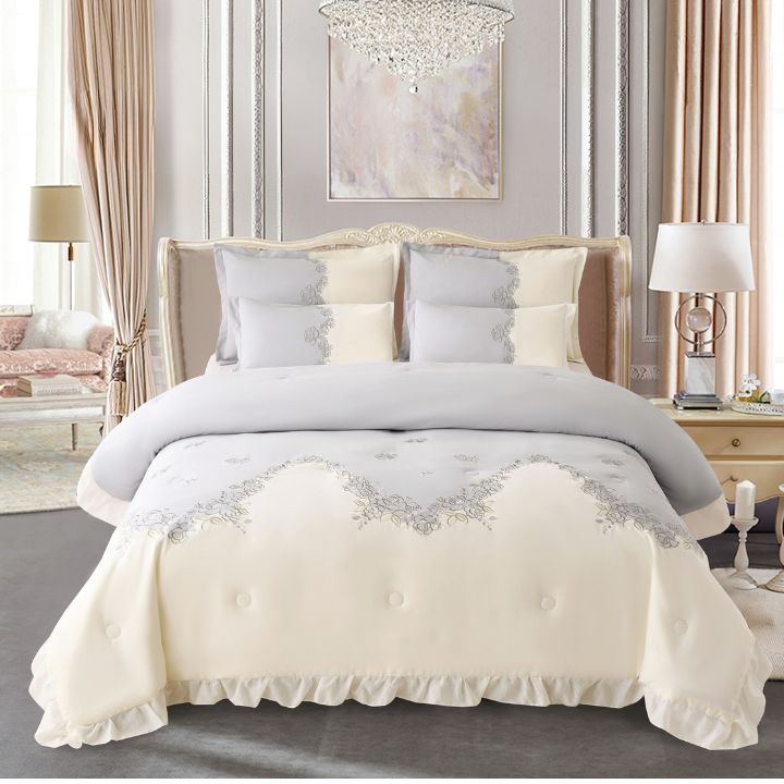 Elegant Regal Blush Aura romantic embroidered luxury bedding set with comforter and bedsheets from The Gharnish, featuring intricate embroidery.