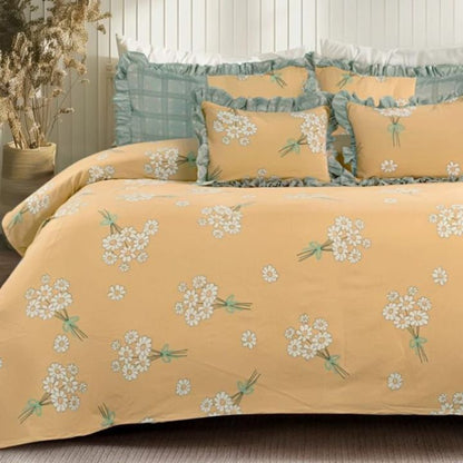 Serenity Bloom quilted bedcover set with 5 pieces, featuring floral patterns in soft pastel colors, by The Gharnish bedding brand.