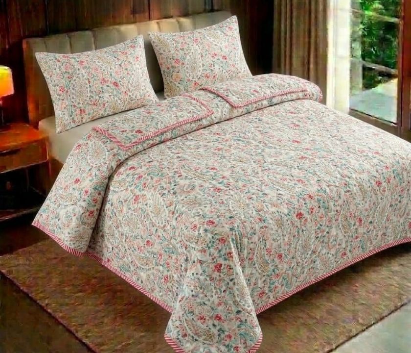 Reversible floral bedding set by The Gharnish with three pieces, featuring colorful floral patterns on soft fabric.