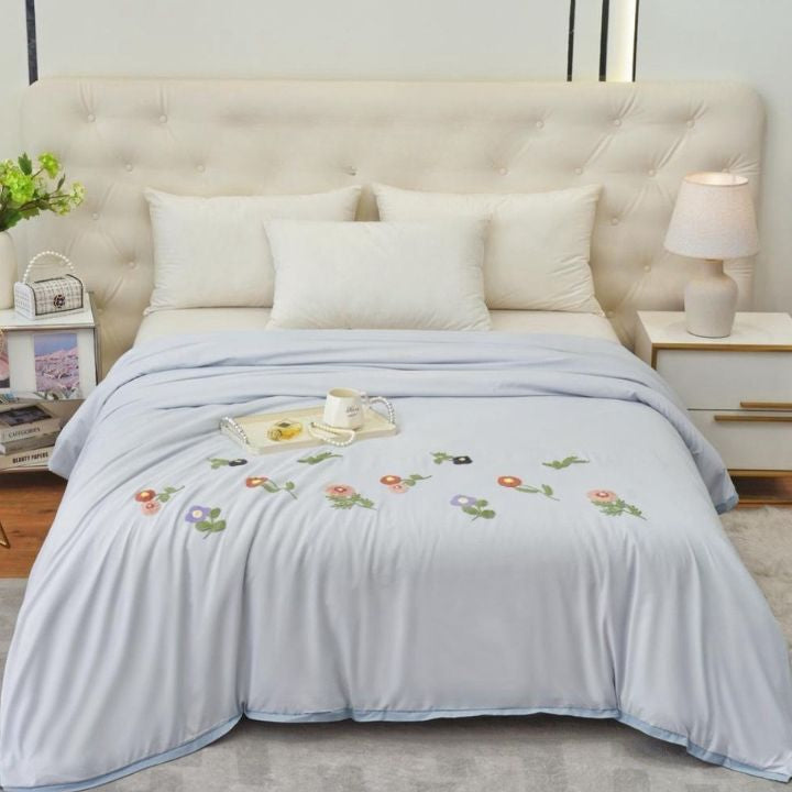 The Gharnish Florista double bed embroidery comforter with floral patterns and intricate stitching on soft fabric.