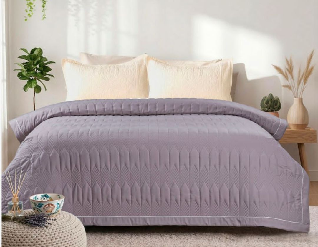 Lightweight luxury comforter by The Gharnish, perfect for all-season bedding, featuring soft fabric and plush filling.