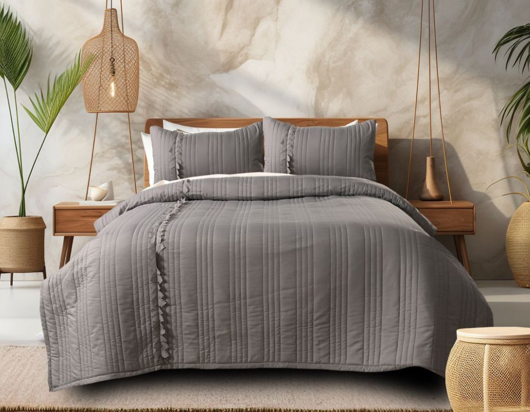 King size designer quilted bedcover with cut work frill from The Gharnish, showcasing intricate quilting and decorative edging.