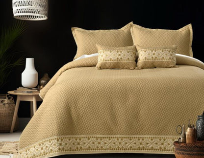 Luxury quilted embroidered bedcover set by The Gharnish, five-piece bedding ensemble with intricate patterns and soft fabric.