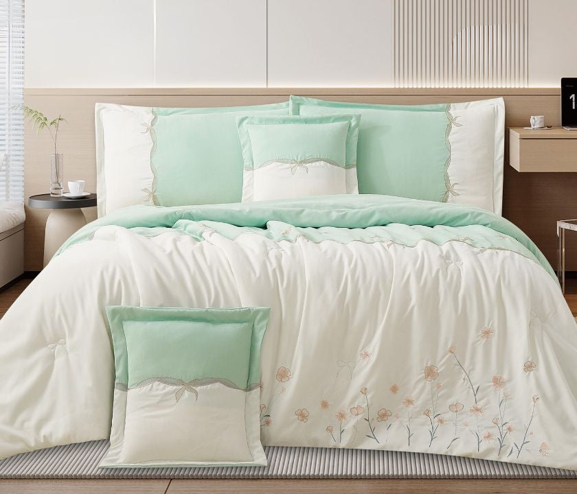 Floral embroidered bedcover set from The Gharnish, soft luxury bedding for modern bedrooms with intricate floral designs.