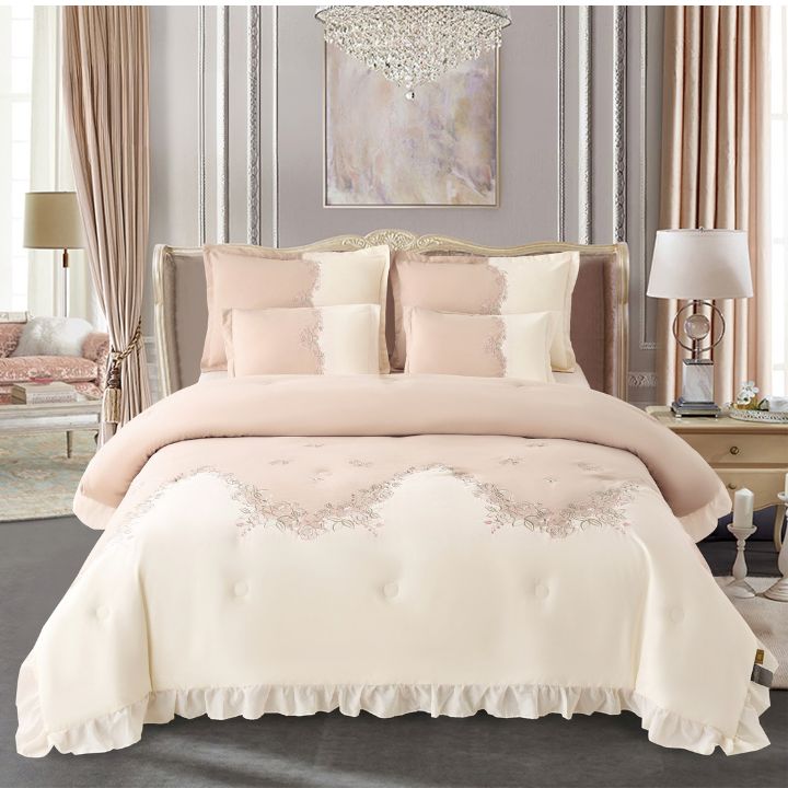 Elegant bedding set featuring a blush aura embroidered comforter and bedsheets from The Gharnish Regal collection.