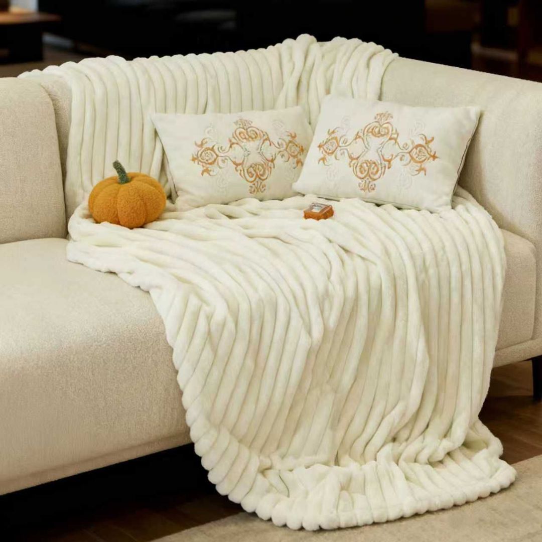 The Gharnish designer rabbit fur style blanket in plush, warm winter fabric, shown folded with soft, luxurious texture.
