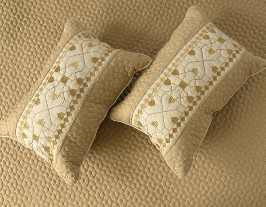 Luxury quilted embroidered bedding set by The Gharnish, 5-piece bedcover set with intricate patterns and soft fabric.