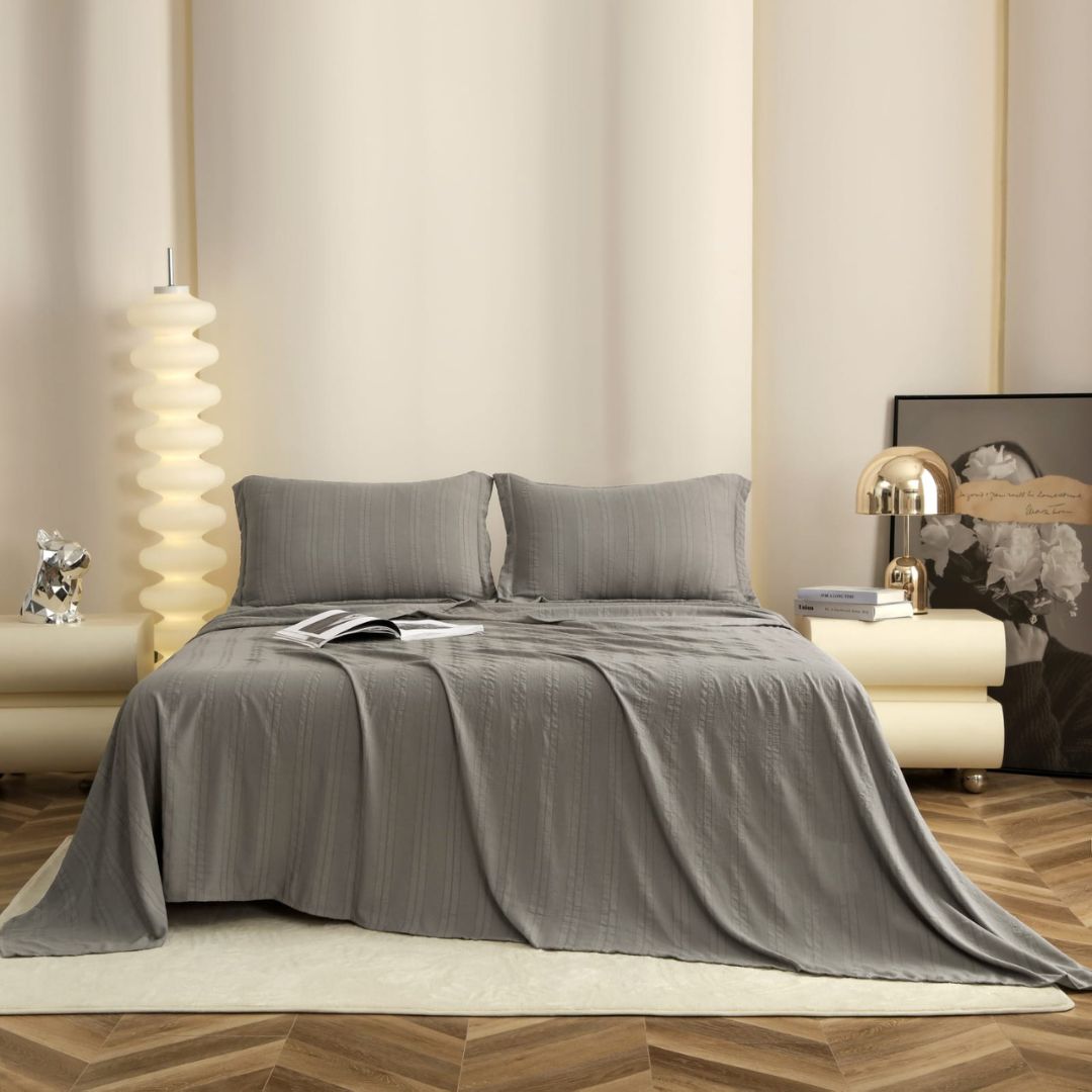 Premium bedsheet 3-piece set by The Gharnish featuring soft English colors, shown on a neatly made bed with matching pillowcases.