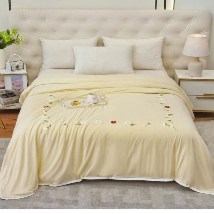 The Gharnish Florista double bed embroidery comforter with floral design and intricate stitching on soft fabric.