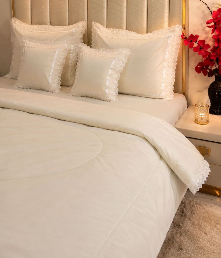 Luxurious quilted king size bedding set by The Gharnish with six pieces, featuring a padded, elegant bedcover design.