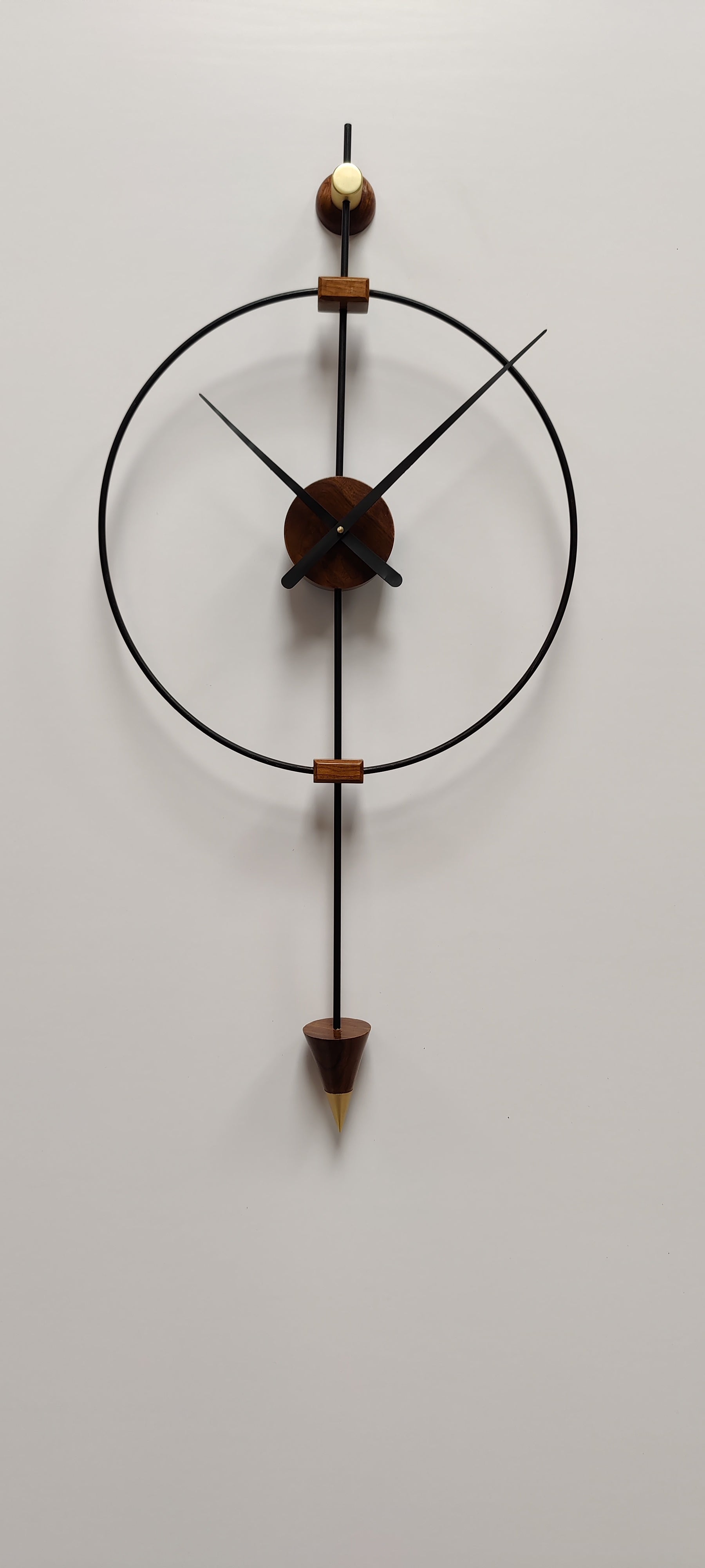 Modern large wooden wall clock by The Gharnish featuring a sleek design, suitable for living room decor and luxury interior style.