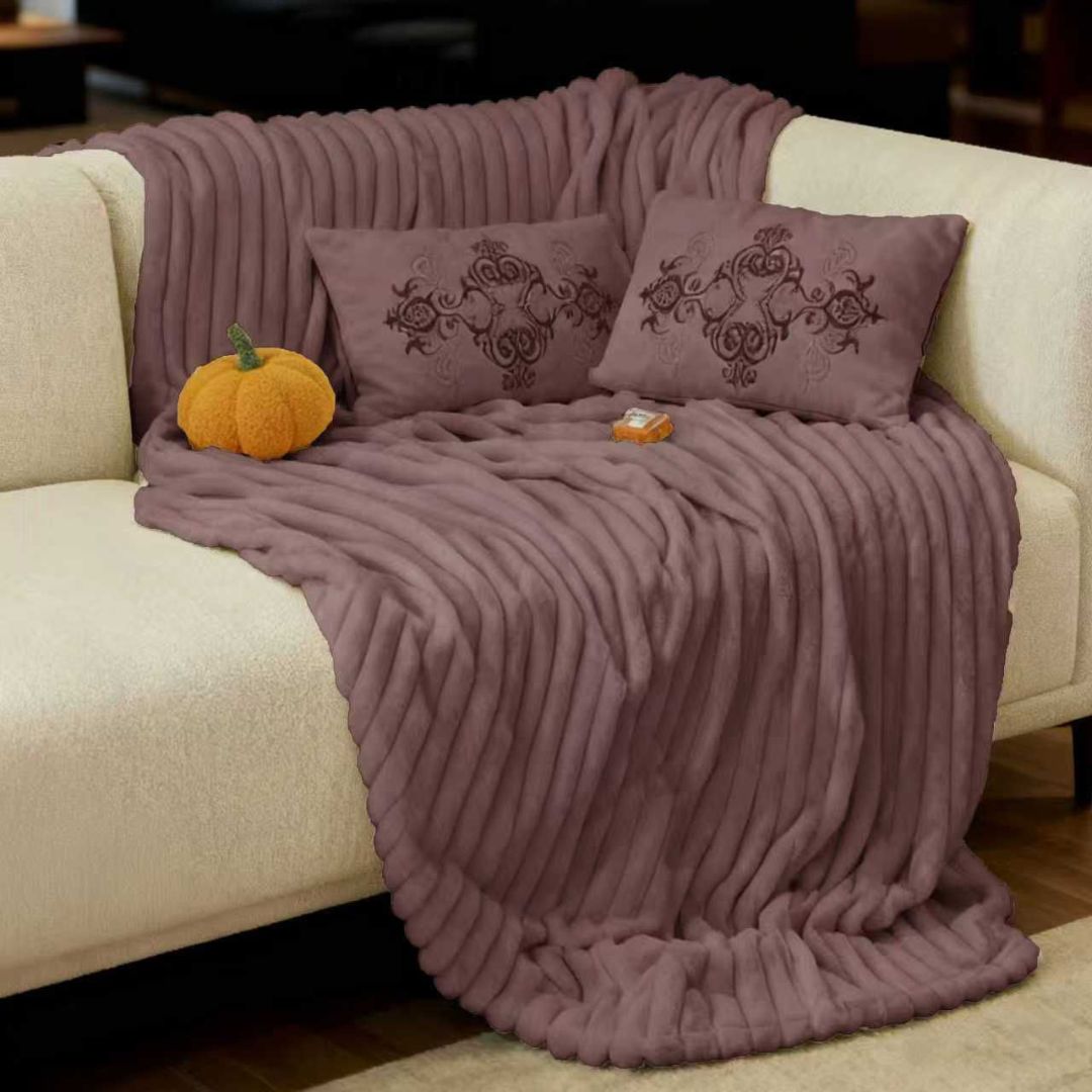 The Gharnish designer rabbit fur style blanket in warm plush winter fabric, showing soft, luxurious texture and cozy appearance.