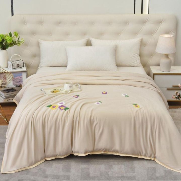 Florista double bed embroidery comforter by The Gharnish, featuring floral patterns and soft fabric for a cozy bedroom look.