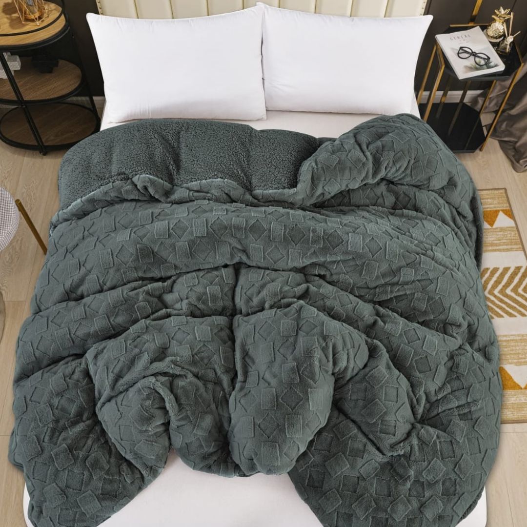 Luxury 2-in-1 rabbit fur and sherpa blanket with duvet cover from The Gharnish, showcasing plush, cozy all-season bedding.