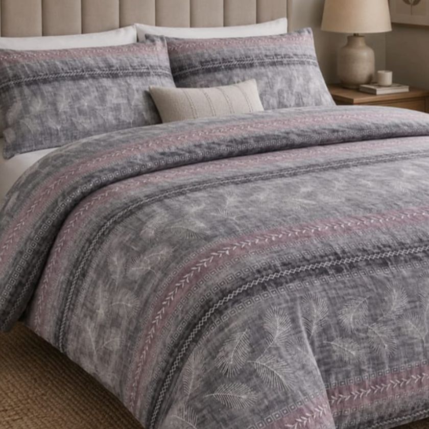 Ashwood Luxe Geometric Bedcover Set by The Gharnish featuring modern bedding with a stylish geometric pattern on a bed.