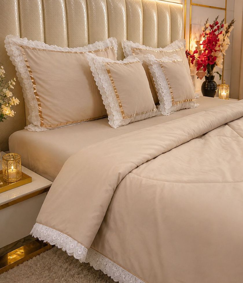 Luxury quilted king size bedcover set by The Gharnish, featuring six matching bedding pieces with a plush, quilted design.