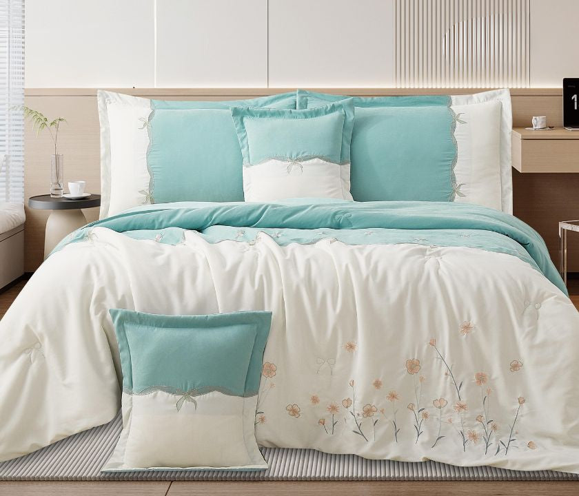 Floral embroidered bedcover set from The Gharnish, soft luxury bedding for modern bedrooms with intricate flower designs.