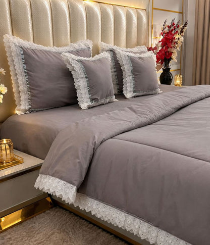Luxury quilted king size bedcover set by The Gharnish, featuring six bedding pieces with intricate quilting and elegant design.