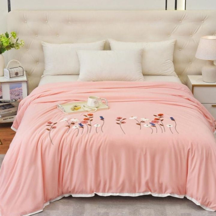The Gharnish Florista double bed embroidery comforter with floral designs on soft fabric, perfect for bedroom decor.