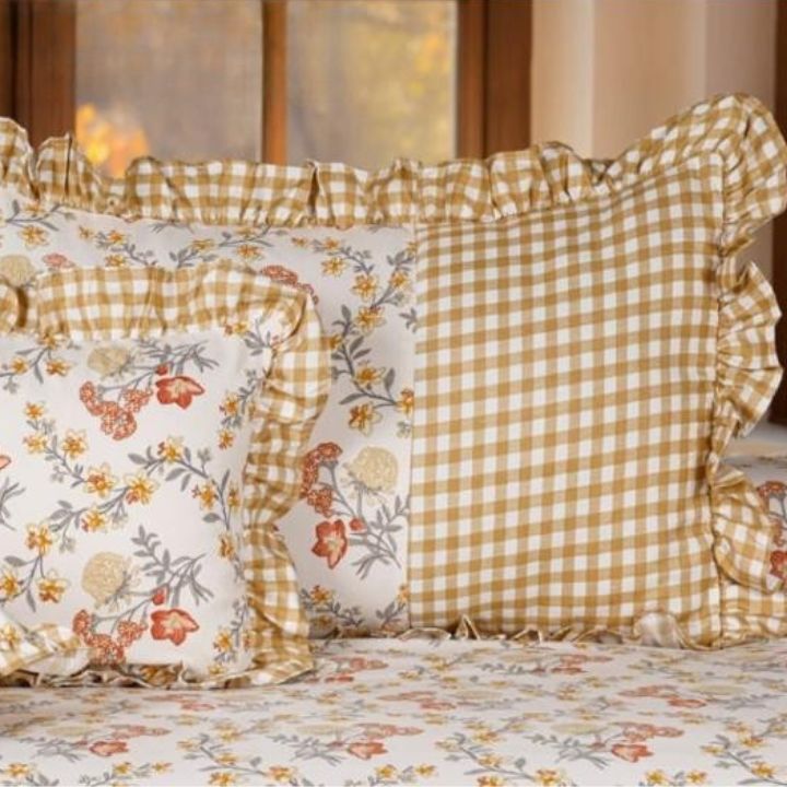 Serenity Bloom quilted 5-piece bedding set by The Gharnish featuring floral patterns and soft fabric for a cozy bedroom decor.