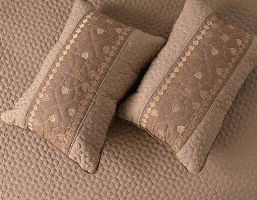 Luxury quilted embroidered bedcover set from The Gharnish, includes five bedding pieces with intricate embroidery and plush fabric.