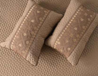 Luxury quilted embroidered bedcover set from The Gharnish, includes five bedding pieces with intricate embroidery and plush fabric.
