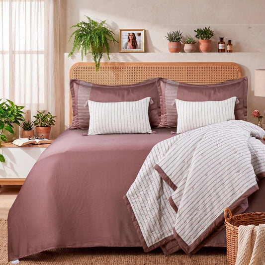 Six-piece WOOVEN BLISS luxury quilted bedding set by The Gharnish, featuring soft, textured fabric and elegant stitching details.