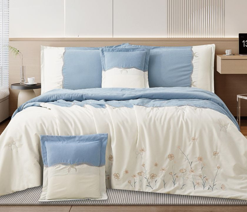 Floral embroidered bedcover set by The Gharnish featuring soft luxury bedding for modern bedrooms, with colorful floral patterns.