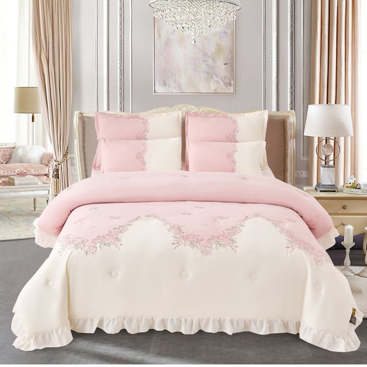 Luxury bedding set by The Gharnish featuring embroidered blush aura romantic comforter and bedsheets in a 6-piece ensemble.