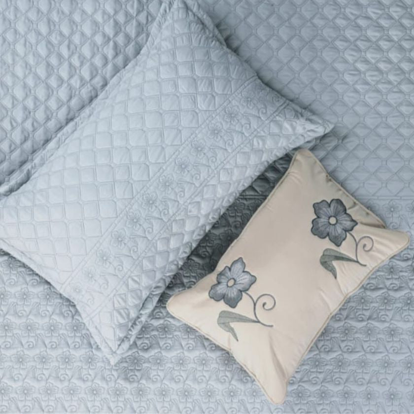 Luxurious Flora 6-piece wedding bedding set from The Gharnish with elegant floral patterns and soft fabric textures.