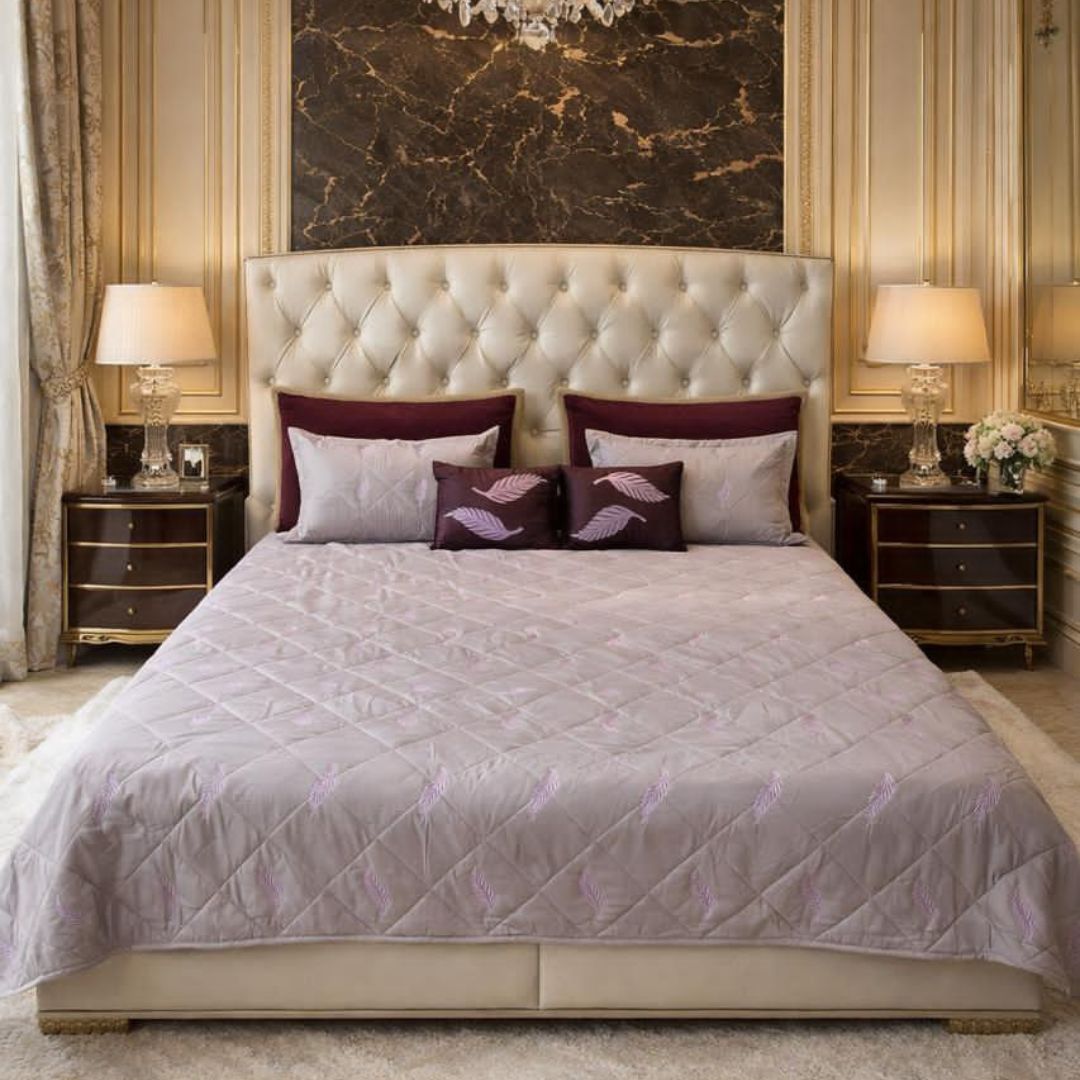 King size quilted bedcover by The Gharnish, Irish designer bedding with intricate quilted patterns on soft fabric.