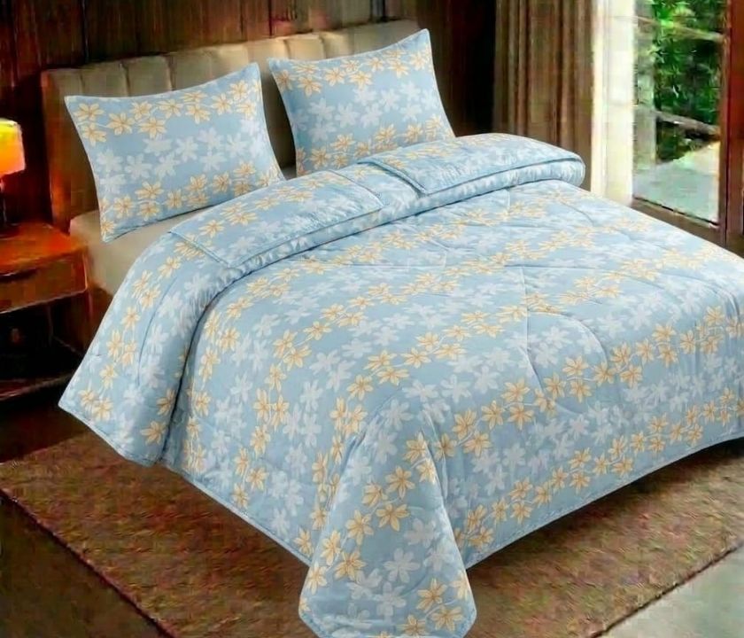 Reversible floral bedding set by The Gharnish featuring three pieces with vibrant flower patterns on soft fabric.