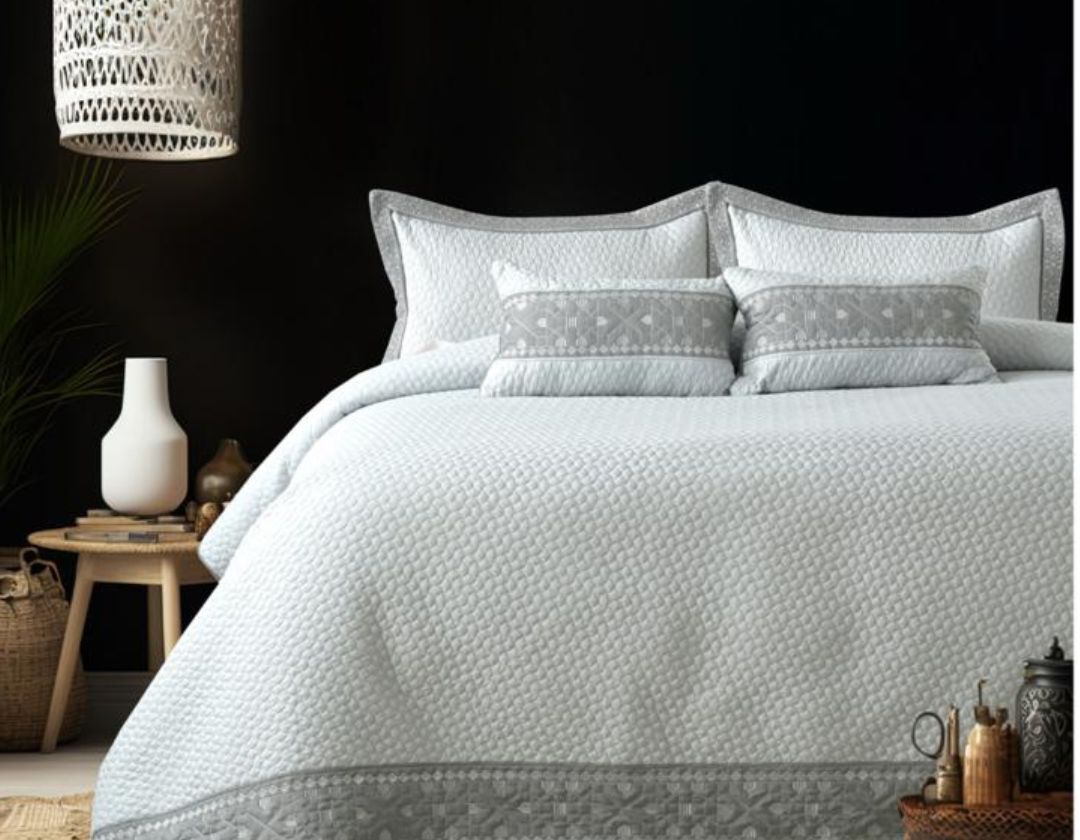 Luxury quilted embroidered bedding set by The Gharnish, 5-piece bedcover ensemble with intricate embroidery and plush fabric.
