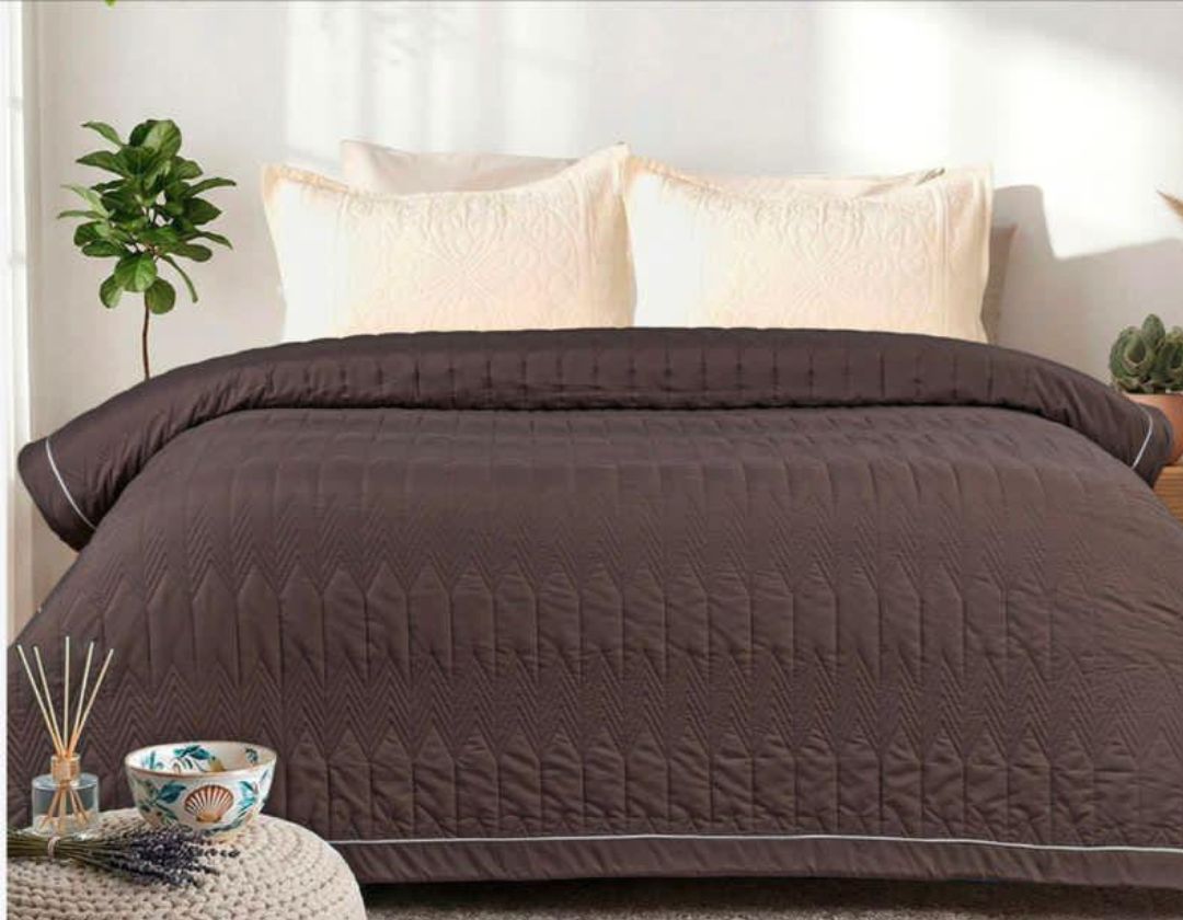 Lightweight luxury bedding comforter from The Gharnish, perfect for all-season use, showcasing soft fabric and plush filling.