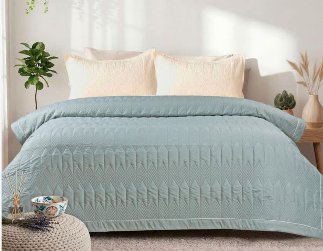 Lightweight luxury comforter from The Gharnish, all-season bedding with plush fabric and cozy filling for year-round comfort.