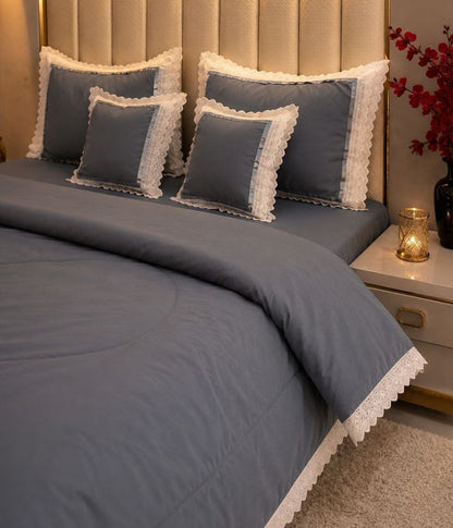 Luxury quilted king size bedcover set by The Gharnish, featuring six bedding pieces with elegant stitching and plush fabric.