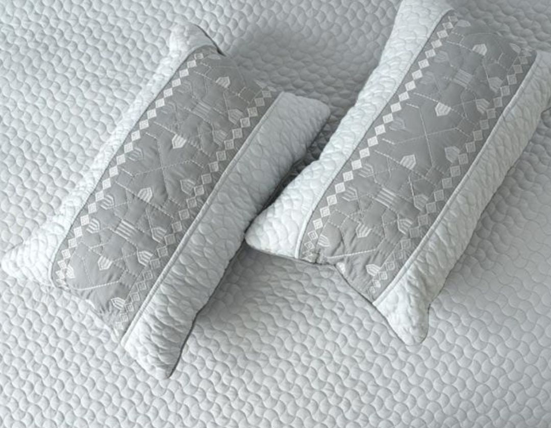 Luxury quilted embroidered bedding set with five pieces from The Gharnish, featuring intricate embroidery and plush fabric.
