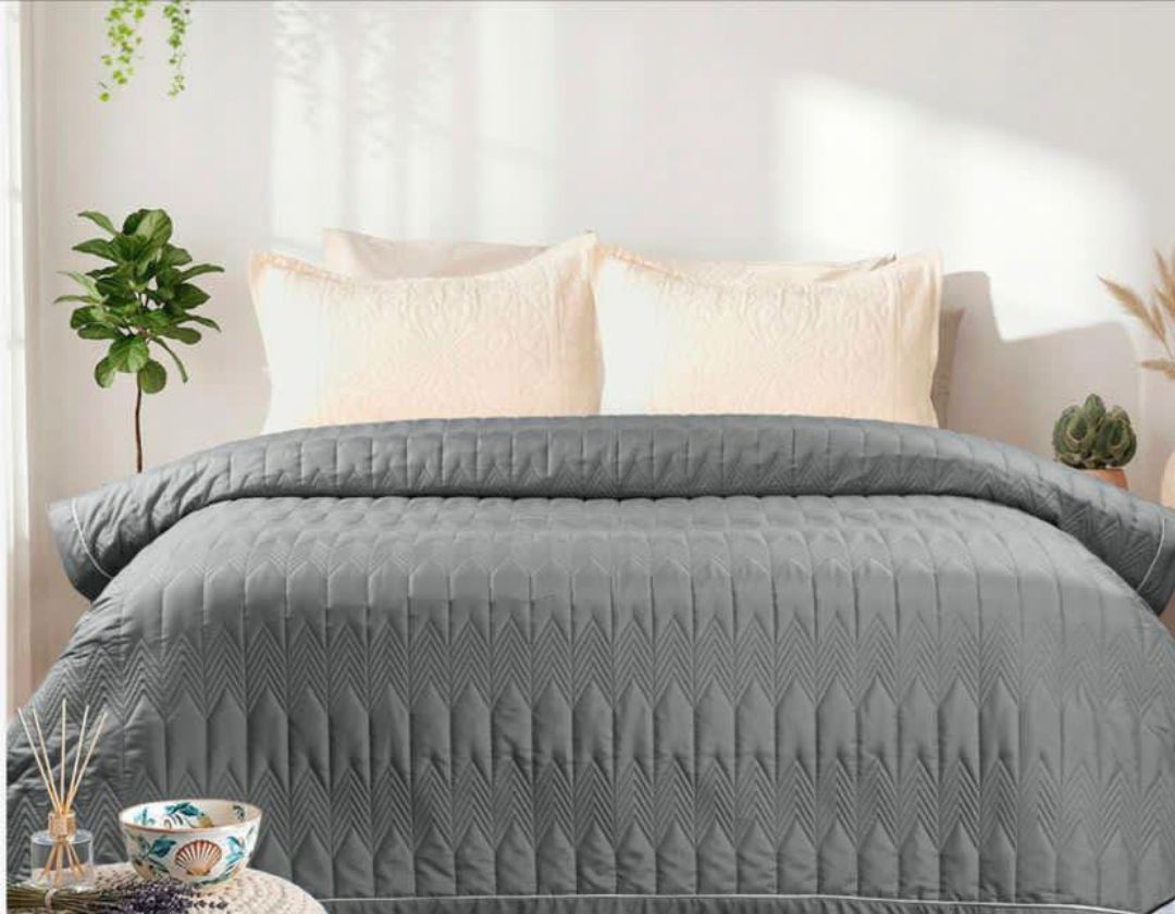 Lightweight luxury comforter from The Gharnish, perfect for all season bedding, showcasing soft, cozy fabric and plush filling.