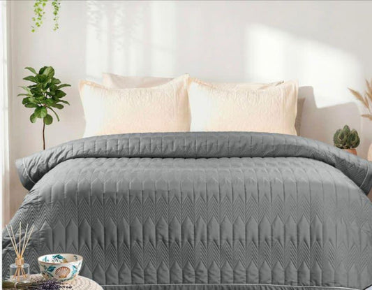 Lightweight luxury comforter from The Gharnish, perfect for all season bedding, showcasing soft, cozy fabric and plush filling.