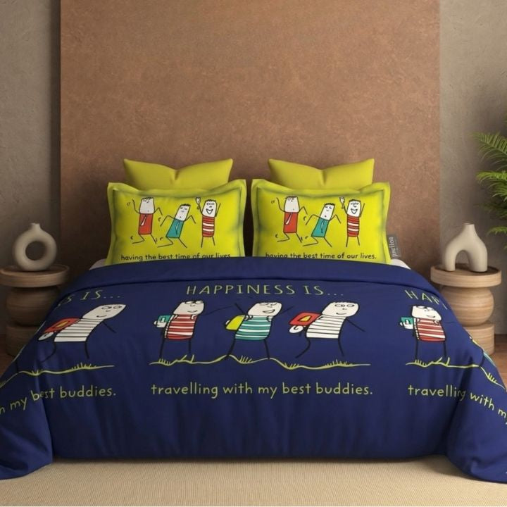 Bedding set with cartoon characters and text on a bed in a bedroom setting.