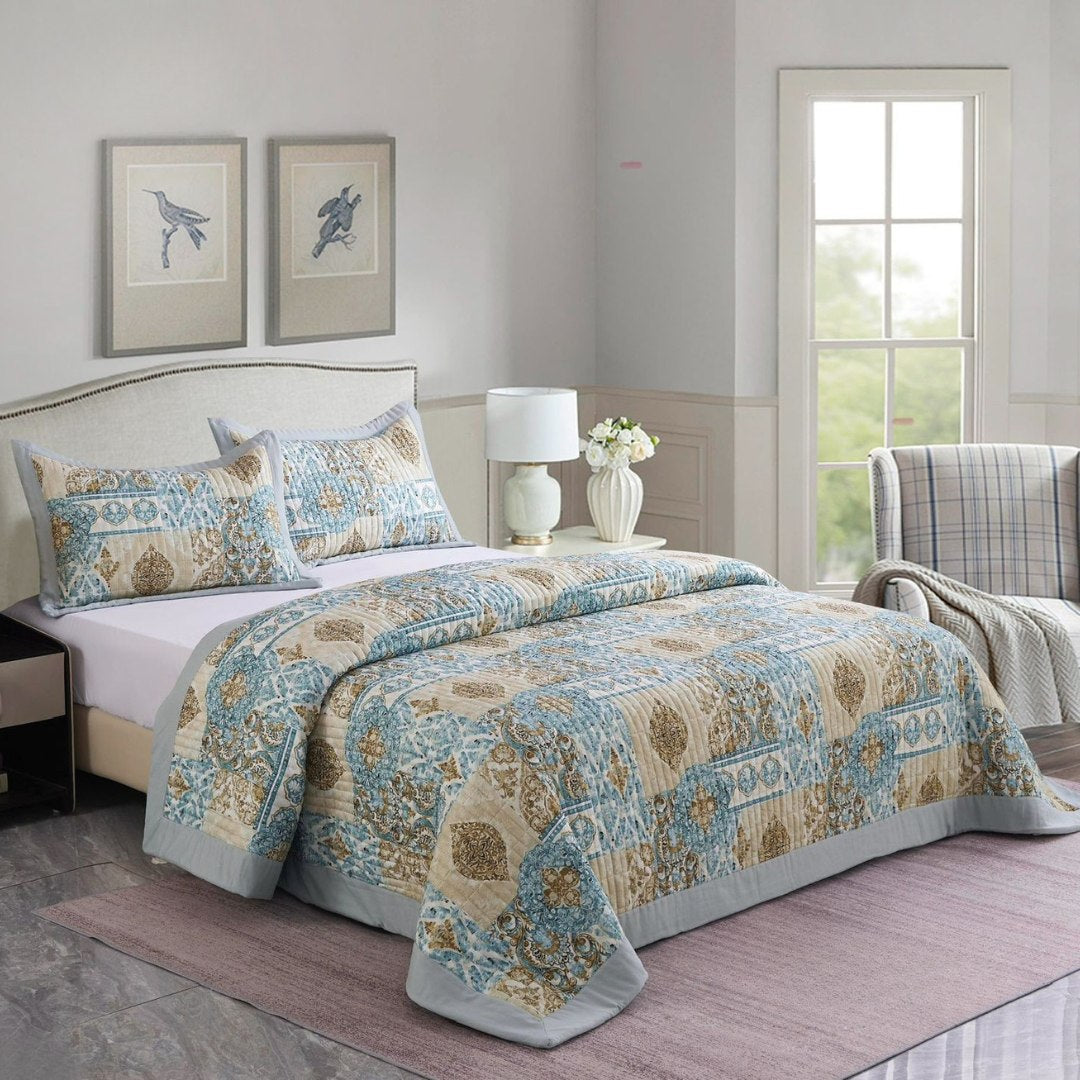 Bedroom with a floral-patterned comforter on a bed, nightstands, and a lamp.
