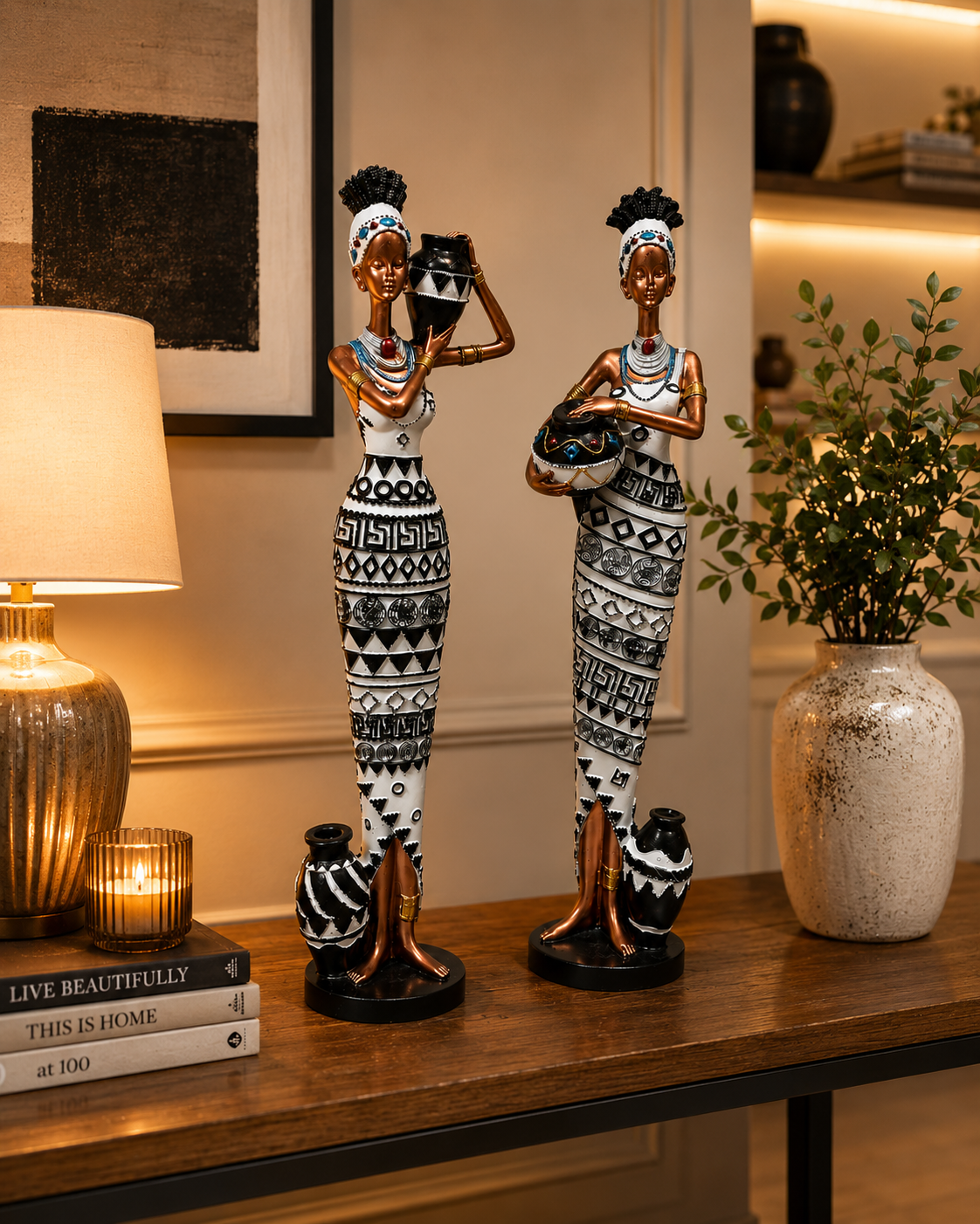 Two abstract tribal-inspired figurines from The Gharnish, perfect for home or office decor, featuring intricate sculptural details.