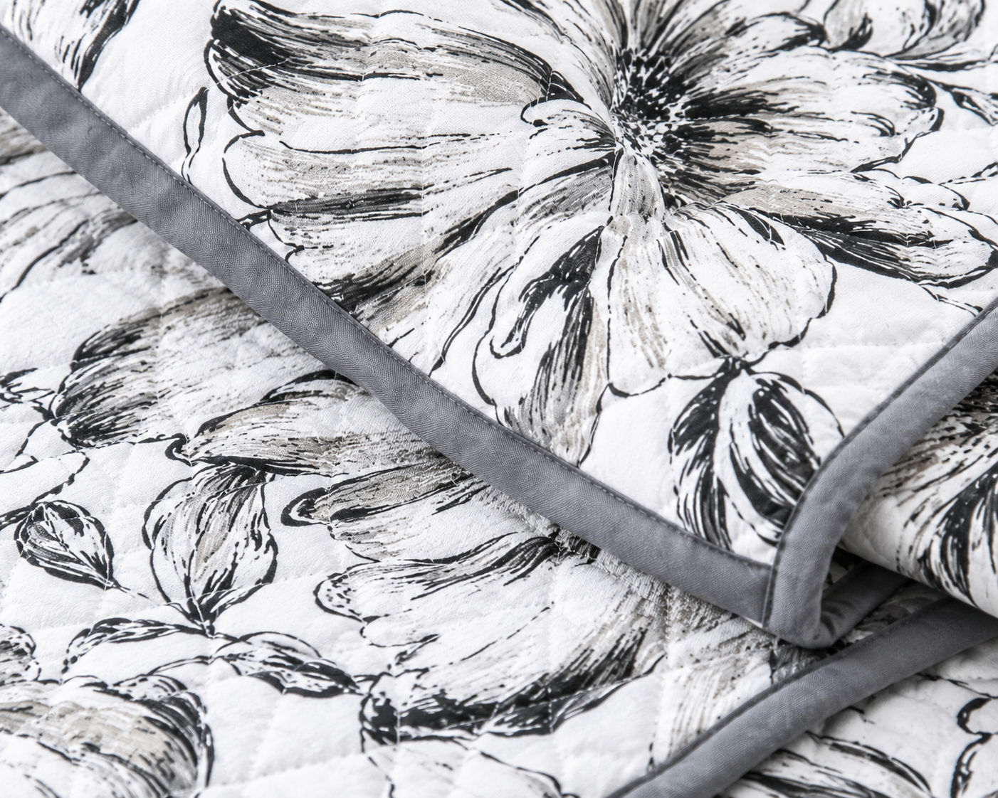 Soft floral bedding set of 3 with quilted bedcover and two matching pillow covers by The Gharnish, perfect for a cozy bedroom.