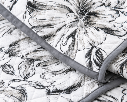 Soft floral bedding set of 3 with quilted bedcover and two matching pillow covers by The Gharnish, perfect for a cozy bedroom.