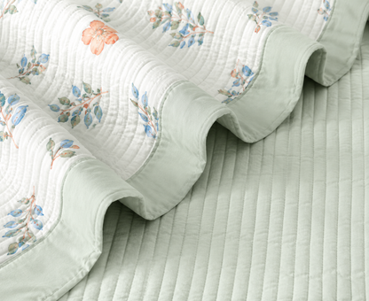 Floral bedding set of 3 with soft quilted bedcover and matching pillow covers from The Gharnish, showcasing vibrant floral patterns.