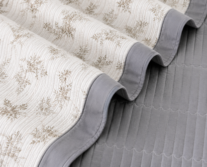 Floral bedding set of 3 with a soft quilted bedcover and matching pillow covers by The Gharnish, featuring colorful floral patterns.