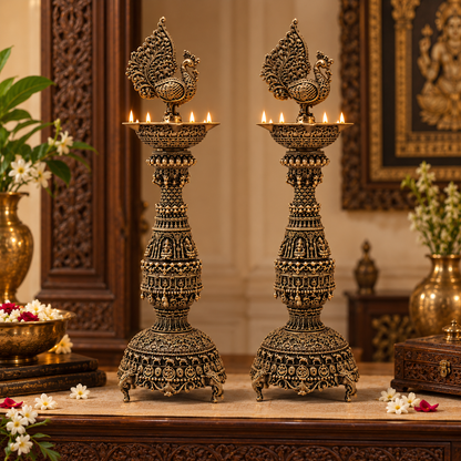 Pair of antique brass peacock diyas, traditional handcrafted brass pooja items for spiritual lighting and decoration.