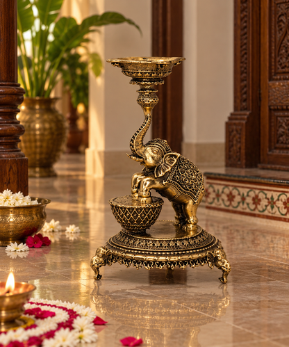 Antique brass elephant diya stand, traditional handcrafted brass pooja item with detailed elephant design for religious ceremonies.