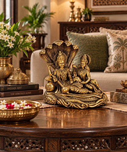 Antique brass Vishnu and Lakshmi divine couple idol on Sheshnag, traditional brass pooja item for spiritual worship.